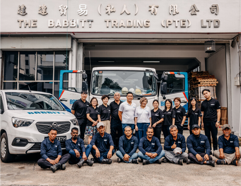 Babbitt Trading team standing in front of their headquarters in Singapore