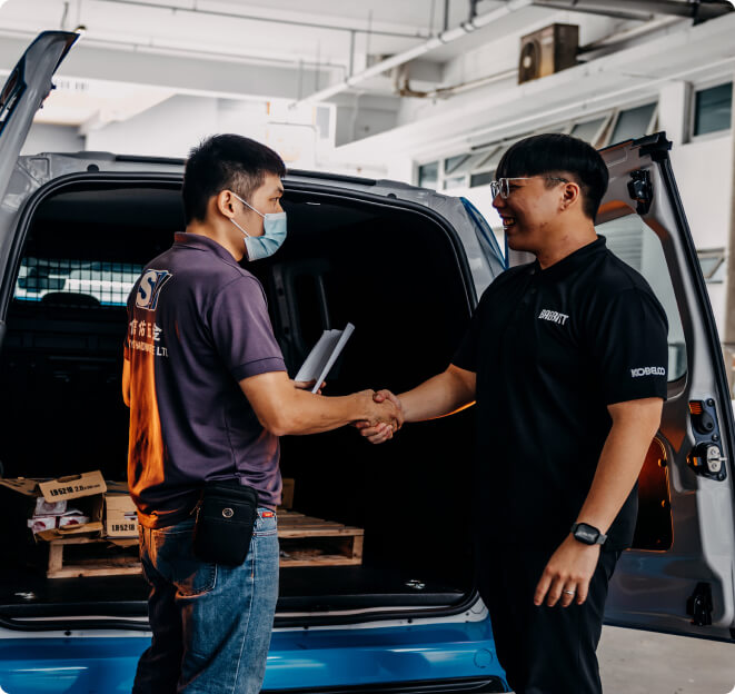 Babbitt Trading staff member shaking hands with a customer